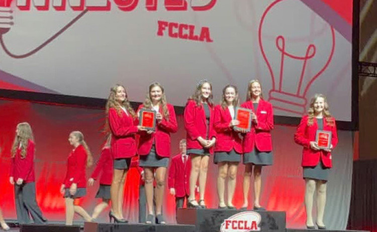 IN TOP THREE AT NATIONALS for the FCCLA (Family, Career and Community Leaders of America) national conference were Spur ISD students Allie Weiser, left, and Paisley Smith of Spur’s Cowgals Snowcones enterprise. The students received their honors at a July 10 ceremony (below) | COURTESY PHOTOS