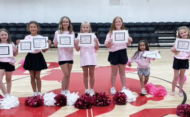 Patton Springs hosted a mini-cheer camp last week for their youngsters. High school volunteers Grace Barron and Tatom Bridge helped with training and leadership during the performance. | COURTESY PHOTOS
