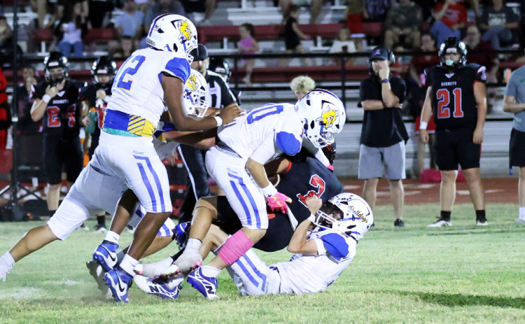 DEFENSE PRESSURE Spur's defense played an aggressive game in the physical 61-16 loss to the Aspermont Hornets Friday night. | COURTESY PHOTO