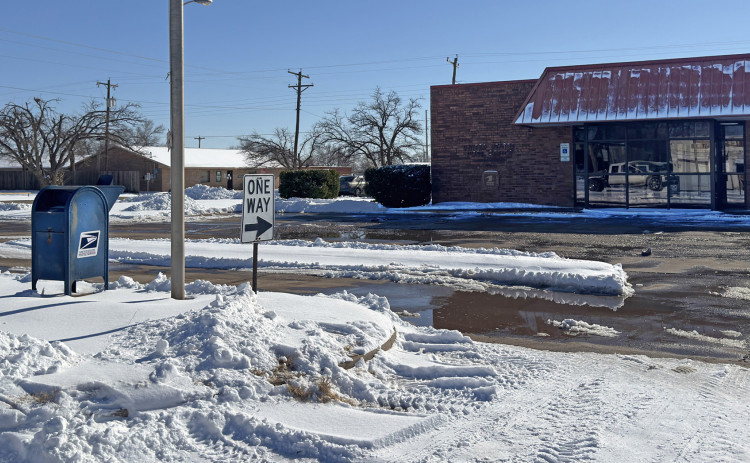 NEITHER SNOW NOR …ICY ROADS? The Spur post office managed to make its parking lot safe for patrons after Winter Storm Fern by Monday morning, Jan. 26, thanks to the efforts of Wes Joplin’s Millitary Mowing, according to postmaster Jason Tanner. The lot was bladed clean with snow piled four feet high on the western edge, and sidewalks were treated with de-icing salt. | TEXAS SPUR