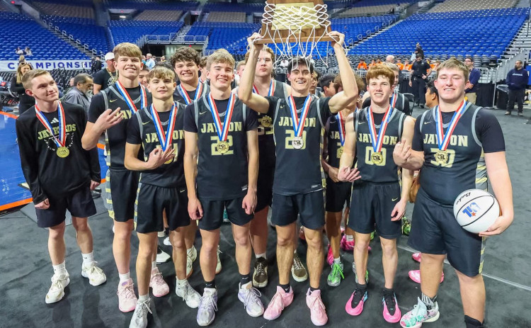VICTORY AT THE ALAMODOME #1 Jayton Jaybirds no. 20, senior Colt Centry, hoists the State 1A D2 basketball championship trophy alongside teammates March 12, 2026, following a 78–45 victory over #13 Kennard. | COURTESY PHOTO