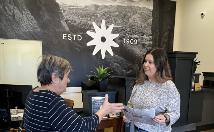 BRANCHING OUT Last Friday Texas Spur publisher Kay Ellington paid a visit to the new Lubbock branch of Spur Security Branch and presented copies of the newspaper carrying the story of the bank’s first branch outside its home county. | COURTESY PHOTO