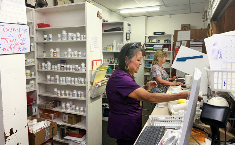 FILLING PILLS at a busy pace is business-as-usual for staffers Priscilla Fraga (left) and Tonya Ryan at locally owned Dana’s Pharmacy in Spur—though pharmacist-owner Dana Tilton must rely on a shrewd product mix to balance out expenses and revenues in a changing environment. | TEXAS SPUR