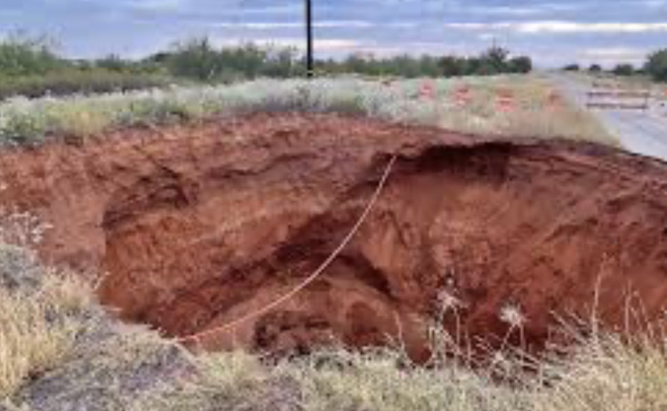 400 DUMP TRUCK LOADS of stone and dirt is what TxDOT estimates will be required to fill a 70-foot-feep sinkhole in rural Cottle County. | TxDOT FACEBOOK PAGE