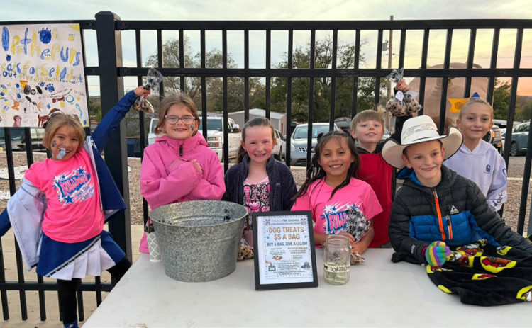 MAKING A DIFFERENCE Spur ISD third graders created a fundraiser to purchase collars and leashes for local dogs, and it sold out Friday night at the Spur varsity football game at Jones Stadium.
