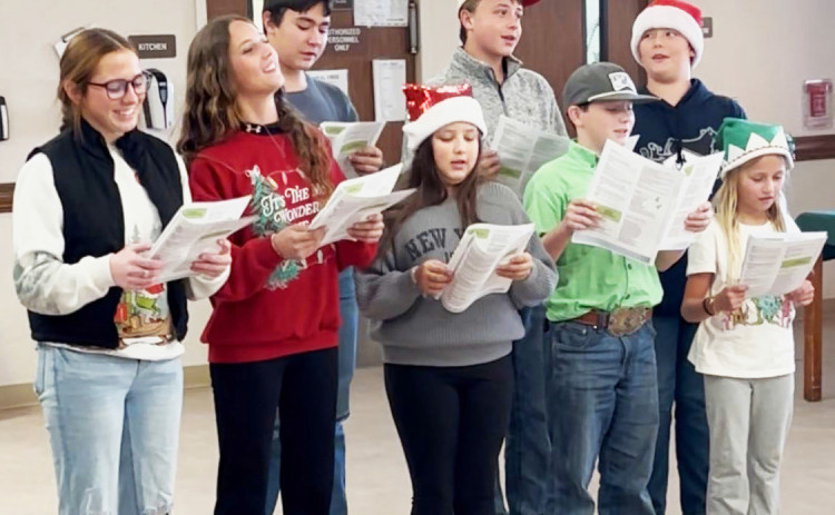 4-H CAROLING Dickens County 4-H spread holiday cheer by singing festive carols for those at nursing homes in Matador and Crosbyton. The joyful faces of the residents lit up as the sweet voices of the 4-H members filled the rooms with music and laughter. The following attended: Tyler Phillips, Paisly Smith, Rylee Foster, Maddee Foster, Henry Chapman, and CalvinHays Chapman, each bringing smiles and warmth to everyone they met. | DICKENS 4-H PHOTO