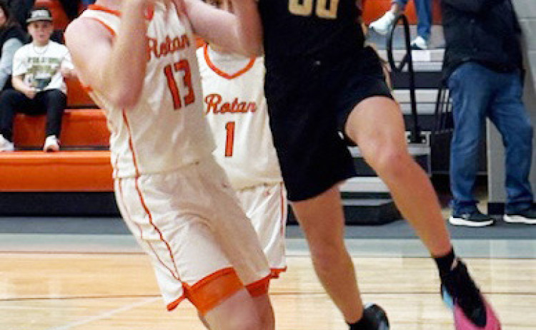 Jaybird Tucker Scott looks to dish off to a teammate in district action in Rotan January 13.