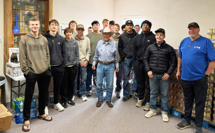 NEIGHBORS HELPING NEIGHBORS Spur Bulldogs athletes delivered KCBD-TV’s annual November food drive supply of turkeys to the Spur Food Bank last week. Food Bank president Tony Ratliff is pictured at center in cowboy hat. | COURTESY PHOTO