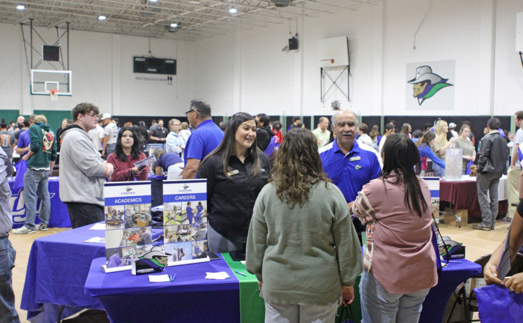 WESTERNTEXASCOLLEGE recruiters Isrell Lawson and Raúl Alcalá speak with prospective students at the 2024 College Fair. | COURTESY PHOTOS