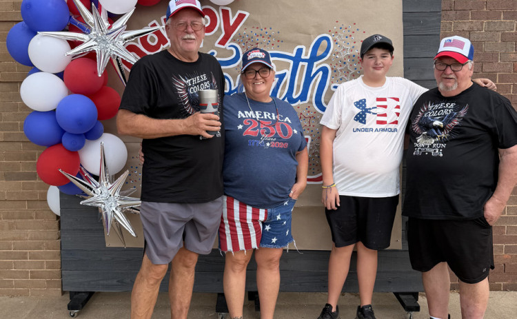 BLUE RIBBON Jay and Jodie Boland earned first place in the golf cart division of the “Cruisin’ for the Red, White and Blue” parade July 4 in Jayton. | STEPHANIE ALLEN