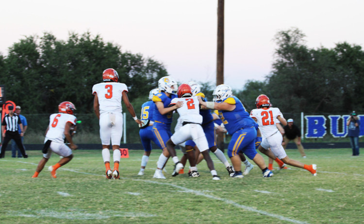 DEFENSE AGAINST DRAGONS wasn’t quite enough to prevent a Bulldog loss at home Friday night. | SPUR YEARBOOK PHOTOS