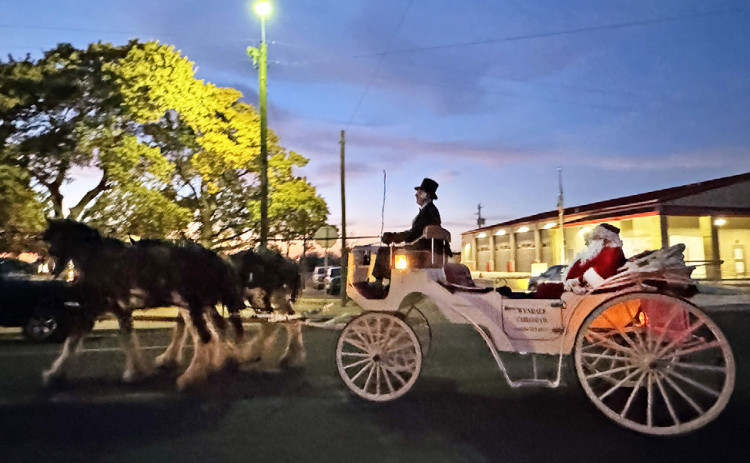 CARRIAGE CLAUS Santa Claus arrived in Spur for a visit last week and came via horse and carriage. | TEXAS SPUR PHOTO