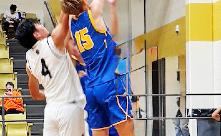 REBOUND Mattijs De Boer grabs a rebound in the Bulldogs’ season opener against Haskell