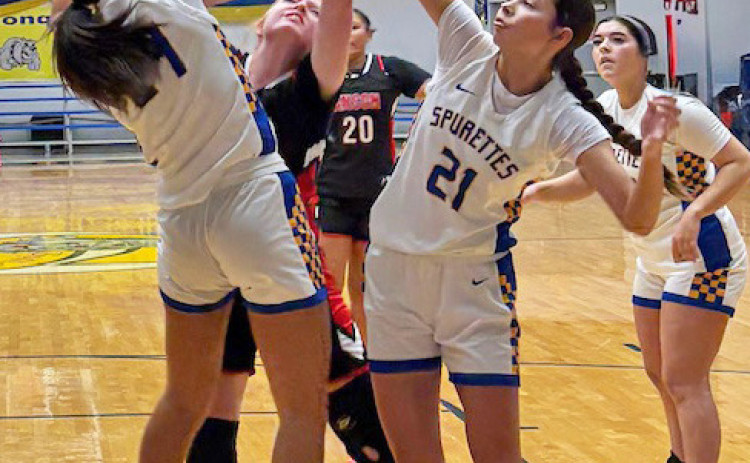 QUEEN AND COURT The Spurettes' Keylee Molina (left) and Kimberlee Segura (21) deny a LadyTiger the shot under the basket. MORE PHOTOS, PAGE 8 | SUE JANE SULLIVAN PHOTOS